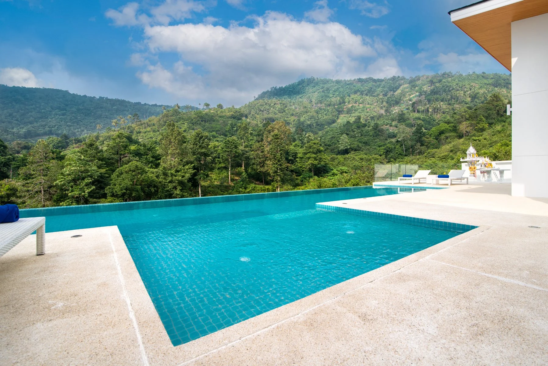 Tropical green hills surrounding Vimaan Vilai